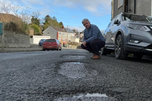 Phil Hutty examining the state of the roads in Bere Alston